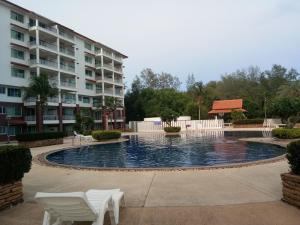 a swimming pool in front of a apartment building at Seaview Condominium B15 in Rayong