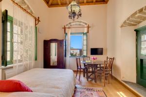 Postel nebo postele na pokoji v ubytování Ritsos Guesthouse