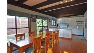 a kitchen and dining room with a table and chairs at SURF PLAZU - SURF SIDE in Inverloch