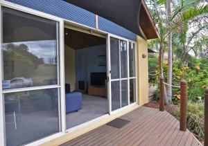 a screened in porch with sliding glass doors at THE SAILS 4 - CENTRAL LOCATION in Inverloch