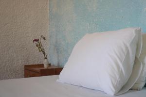 Postel nebo postele na pokoji v ubytování Madalenas B&B