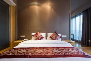 Krevet ili kreveti u jedinici u okviru objekta SLOWCOM-Xingyue Pa Zhou Apartment