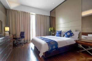 Postel nebo postele na pokoji v ubytování SLOWCOM-Xingyue Pa Zhou Apartment