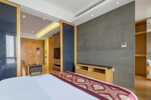 Postel nebo postele na pokoji v ubytování SLOWCOM-Xingyue Pa Zhou Apartment