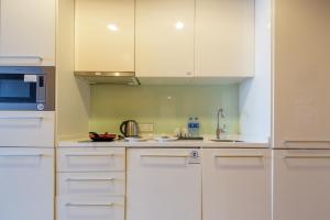 Kuchyň nebo kuchyňský kout v ubytování SLOWCOM-Xingyue Pa Zhou Apartment