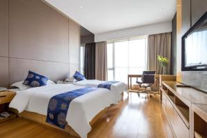 Postel nebo postele na pokoji v ubytování SLOWCOM-Xingyue Pa Zhou Apartment