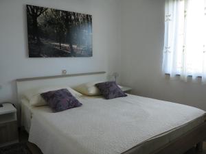Postel nebo postele na pokoji v ubytování Apartments Potočki