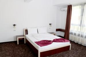 מיטה או מיטות בחדר ב-Hotel Restaurant Imperial