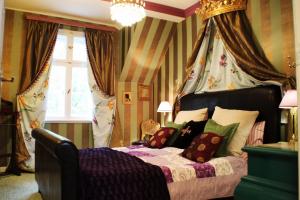 Кровать или кровати в номере Villa am Stechlin