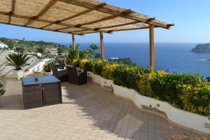a patio with a view of the ocean at Maridea - La Procella in Ponza