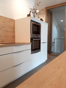Kuchyň nebo kuchyňský kout v ubytování Apartments ALPA VITA
