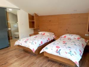 Postel nebo postele na pokoji v ubytování Apartments ALPA VITA