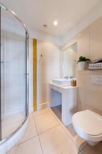 Ванна кімната в Les Cocons - 8 appartements à 100m du Vieux Port