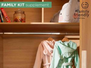 a closet with some clothes on a shelf at Hotel Mirna - Terme & Wellness LifeClass in Portorož