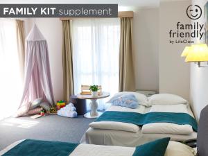Giường trong phòng chung tại Hotel Mirna - Terme & Wellness Lifeclass