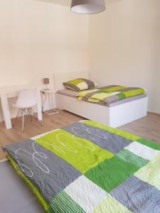 a bedroom with a bed and a rug on the floor at Quartier "Zur Alten Apotheke" in Brackenheim
