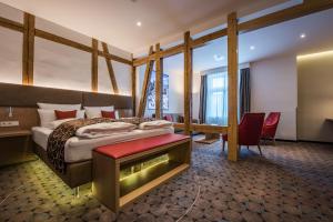 Postel nebo postele na pokoji v ubytování AKZENT Hotel Villa Saxer