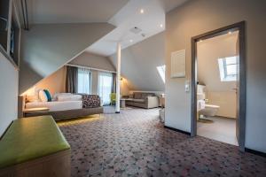 Postel nebo postele na pokoji v ubytování AKZENT Hotel Villa Saxer