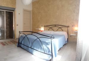 Krevet ili kreveti u jedinici u objektu Appartamenti di Claudia 1 locazione turistica