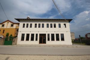 a white building on the side of a street at Hotel Agreno in Berat