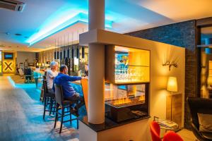 TV a/nebo společenská místnost v ubytování AKZENT Hotel Villa Saxer