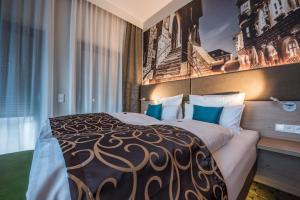 Postel nebo postele na pokoji v ubytování AKZENT Hotel Villa Saxer