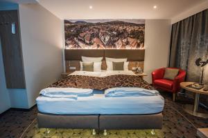 Postel nebo postele na pokoji v ubytování AKZENT Hotel Villa Saxer