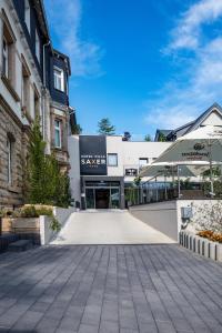 an empty courtyard in front of a building at AKZENT Hotel Villa Saxer in Goslar