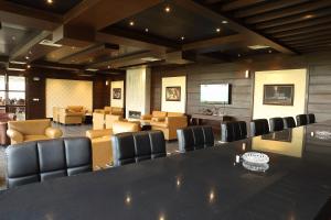 a conference room with a large table and chairs at Defence Raya Golf & Country Club in Lahore +49 photos