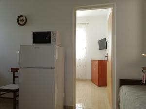 Televízia a/alebo spoločenská miestnosť v ubytovaní Apartment Ivo Mazic