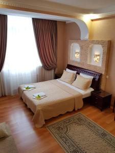 Łóżko lub łóżka w pokoju w obiekcie Small accommodation facility Guest house Zolotaya Milya