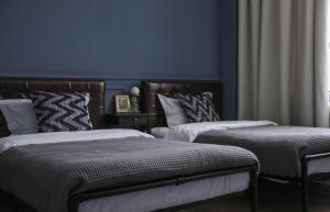 Ένα ή περισσότερα κρεβάτια σε δωμάτιο στο Iris Hotel Beijing Temple of Heaven +24 φωτογραφίες