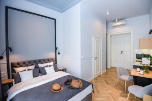 Łóżko lub łóżka w pokoju w obiekcie Bentis Luxury Apartments