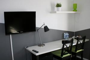 TV a/nebo společenská místnost v ubytování Taastrup Park Hotel