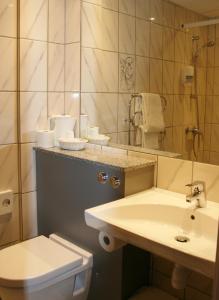 Ett badrum på Taastrup Park Hotel