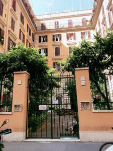 a gate in front of a large building at B&B Sergio House in Rome