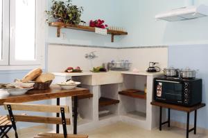 A kitchen or kitchenette at Kalamata Art Rooms