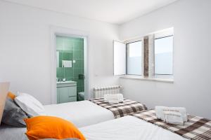 Uma cama ou camas num quarto em Casas de Sequeiros