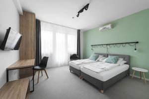 Posteľ alebo postele v izbe v ubytovaní Chesscom Hotel