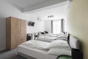Posteľ alebo postele v izbe v ubytovaní Chesscom Hotel