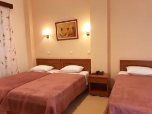 Posteľ alebo postele v izbe v ubytovaní Hotel Kronio