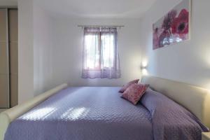Ein Bett oder Betten in einem Zimmer der Unterkunft Apartments Villa Tre Marie