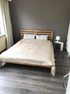 מיטה או מיטות בחדר ב-Appartement224
