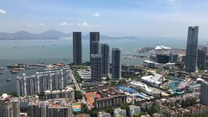 an aerial view of a city with tall buildings at The Clouds Apartment in Shenzhen