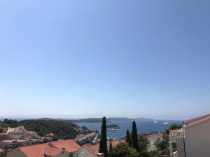 a view of the ocean from a city at Apartments and Rooms Jasna in Hvar