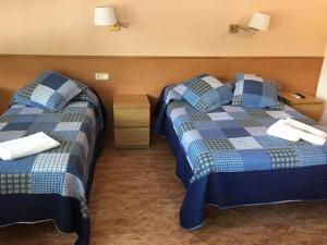 Ένα ή περισσότερα κρεβάτια σε δωμάτιο στο Hostal Rio De Castro