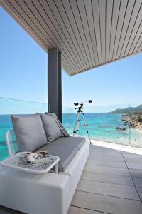 a living room with a couch and a view of the ocean at Son Moll Sentits Hotel & Spa in Cala Ratjada