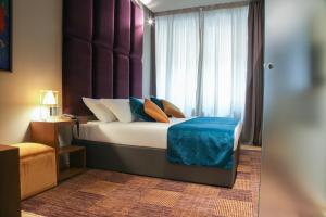 Voodi või voodid majutusasutuse Triviho Hotel toas