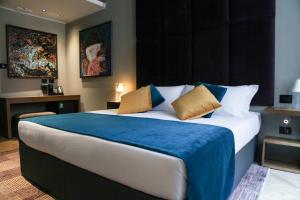Voodi või voodid majutusasutuse Triviho Hotel toas