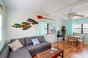 a living room with a couch and a table at Cindy Villa in Key Largo